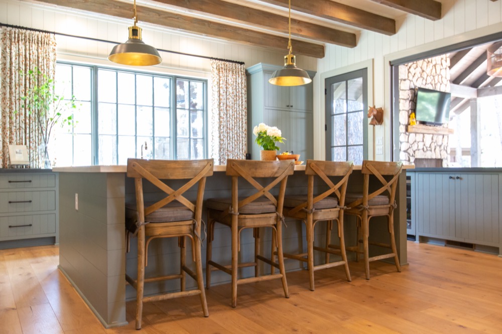 Kitchen with sage cabinets and wood ceiling