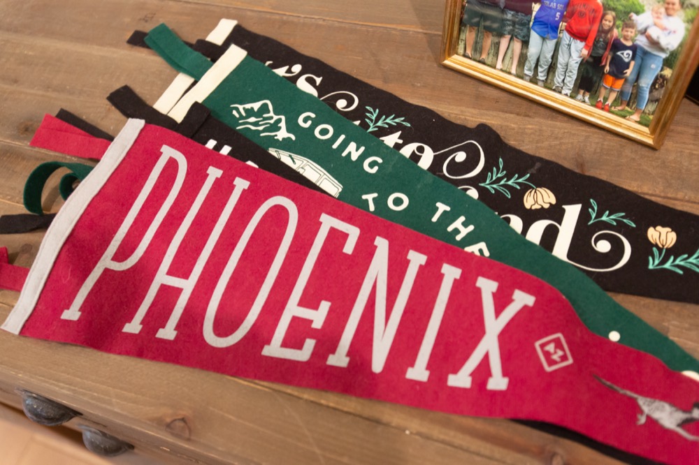 A Phoenix pennant and bedding in a cabin bedroom
