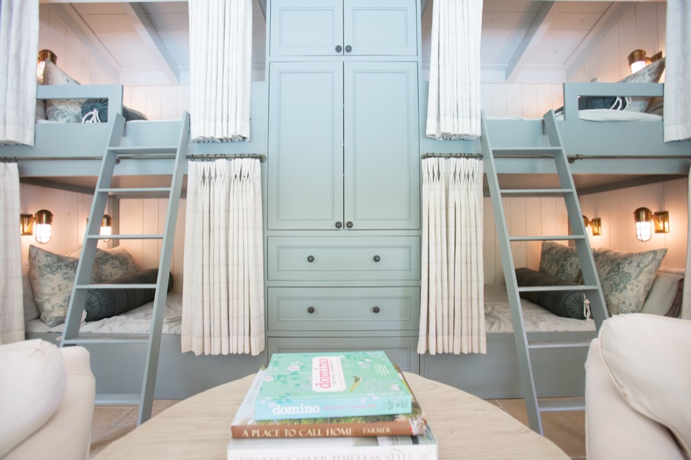 Pool house bunk room with blue-gray built-ins