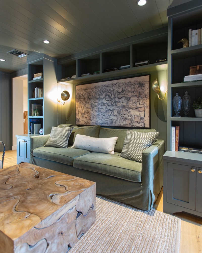 Sage green study with built-in shelves