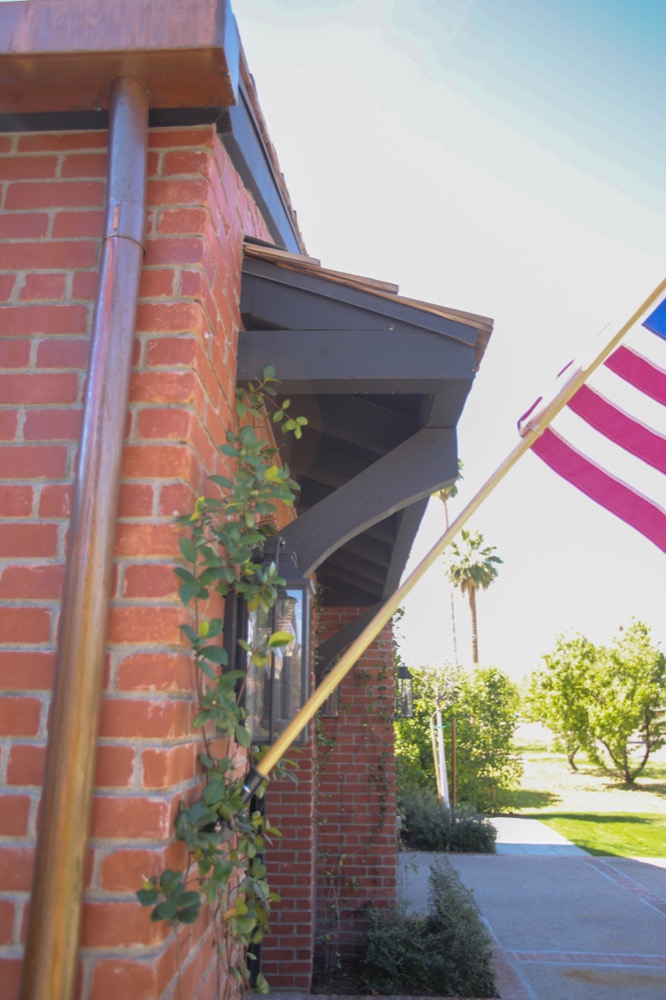 Brick chimney with a flag, State Ave