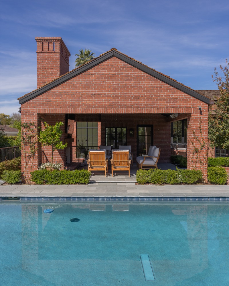Pool with brick chimney behind
